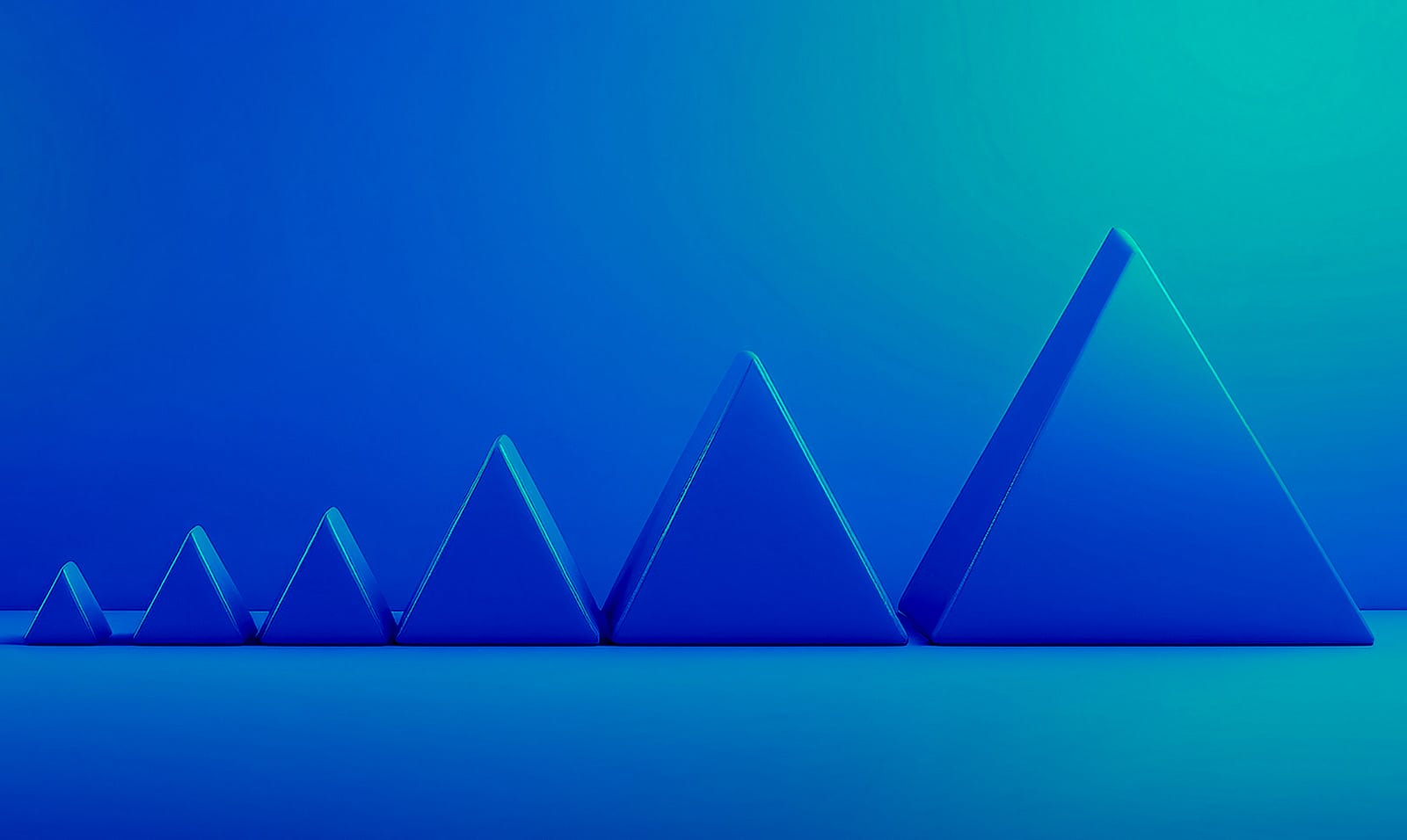 Blue 3D triangular prisms in increasing size arranged on a gradient blue-green background.
